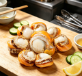 Seared scallops with fresh garnishes, plated